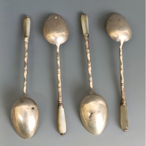 278 - A set of four Chinese silver coloured metal and mother of pearl small spoons