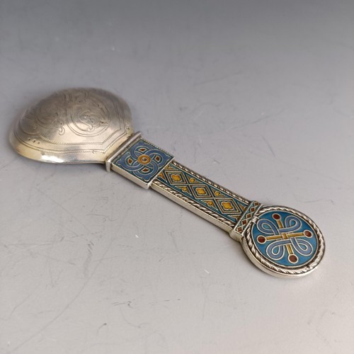 284 - A caddy type spoon, with Celtic style enamel decoration, 11.5 cm