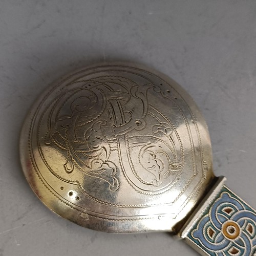 284 - A caddy type spoon, with Celtic style enamel decoration, 11.5 cm