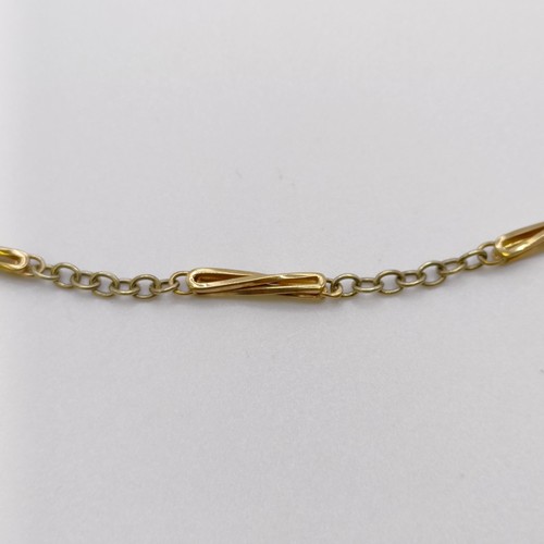 500A - A 9ct yellow and white gold chain, 9.4 g...