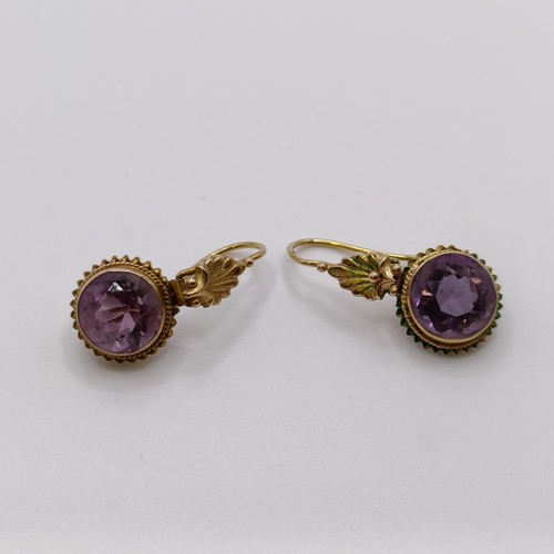 508 - A Victorian purple stone brooch, and a similar pair of earrings...