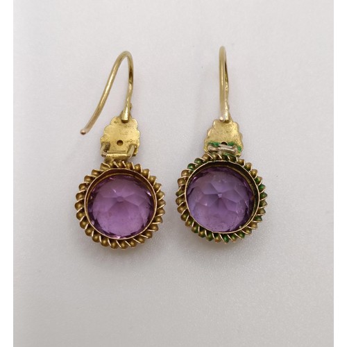 508 - A Victorian purple stone brooch, and a similar pair of earrings...