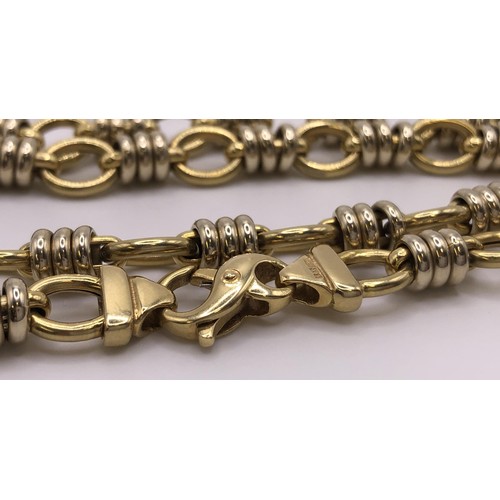 510 - An 18ct gold Chanel style fancy link chain, 41.4 g...