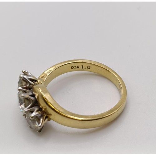 514 - An 18ct gold and three stone diamond ring, central stone 0.3ct approx., ring size K