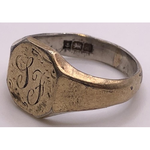 516 - A 9ct gold and brown stone ring, ring size O, and a silver signet ring