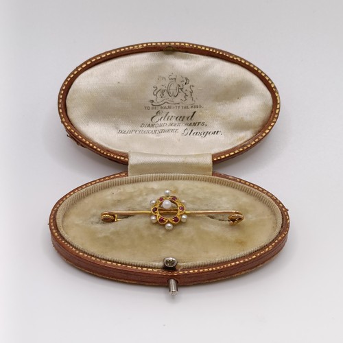 517 - A late 19th/early 20th century seed pearl and red stone bar brooch, in a vintage jewellery box, with...