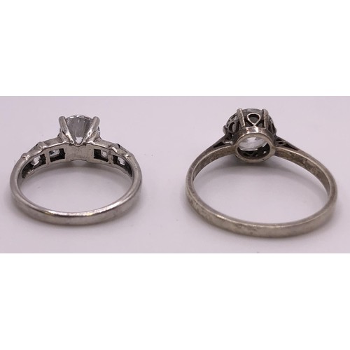 532 - A dress ring, set with an emerald cut white stone, ring size Q, and assorted other dress rings (5)