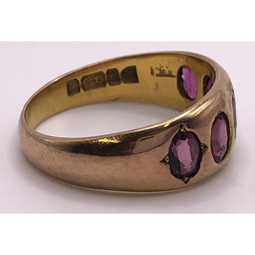 539 - A 9ct gold and pink stone five stone ring, ring size N