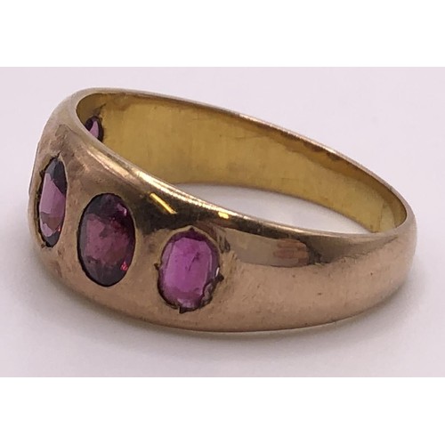 539 - A 9ct gold and pink stone five stone ring, ring size N