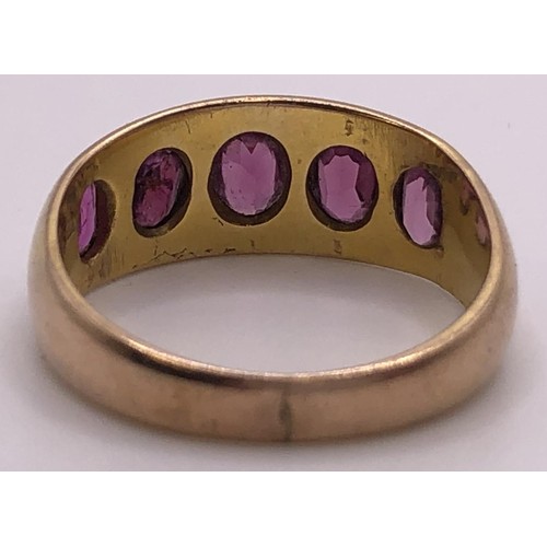 539 - A 9ct gold and pink stone five stone ring, ring size N