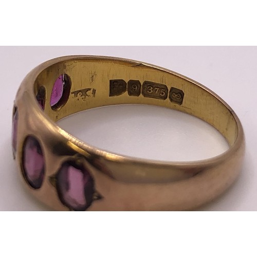 539 - A 9ct gold and pink stone five stone ring, ring size N