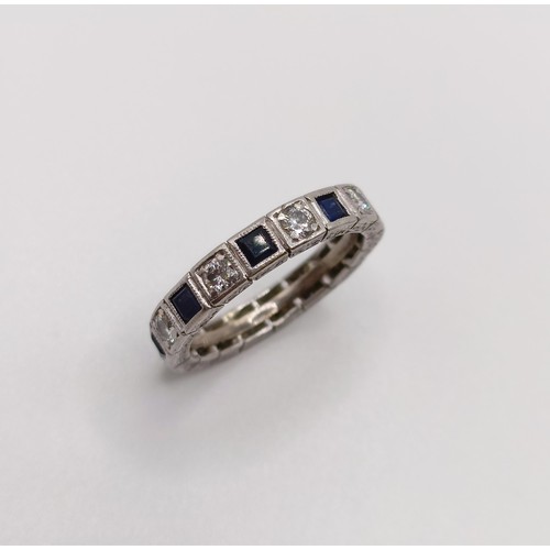 541 - A platinum, diamond and sapphire full eternity ring, ring size L