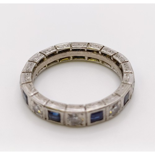 541 - A platinum, diamond and sapphire full eternity ring, ring size L