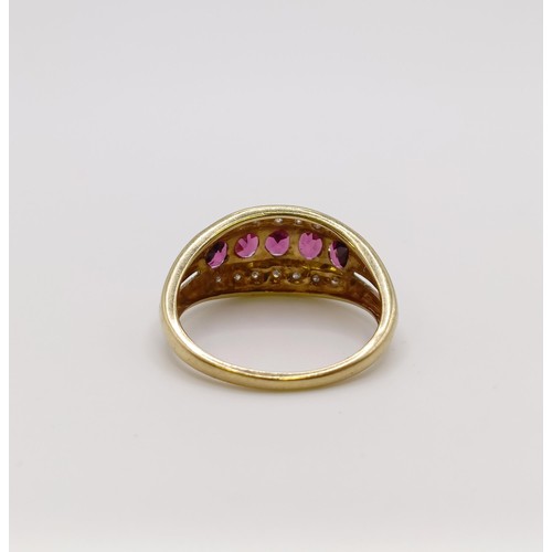 542 - A 9ct gold, diamond and red stone ring, ring size N