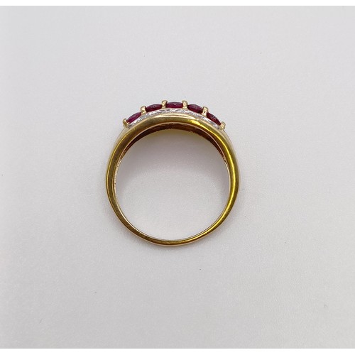 542 - A 9ct gold, diamond and red stone ring, ring size N