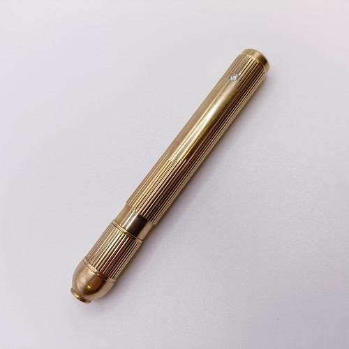 546 - A 9ct gold cased pencil, all in 29.9 g...