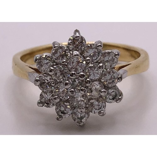 554 - A yellow metal and white stone cluster ring, ring size R