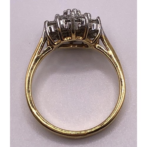 554 - A yellow metal and white stone cluster ring, ring size R