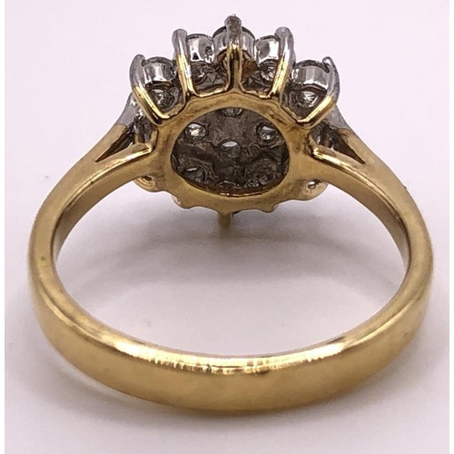 554 - A yellow metal and white stone cluster ring, ring size R