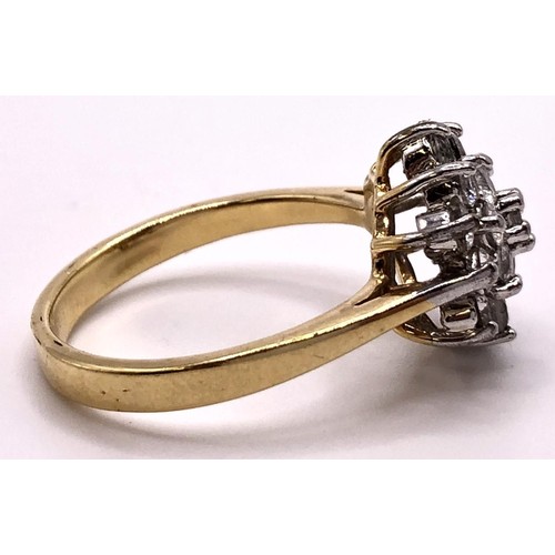 554 - A yellow metal and white stone cluster ring, ring size R