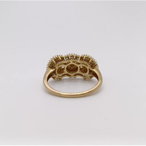 555 - A 9ct gold triple cluster ring, ring size S