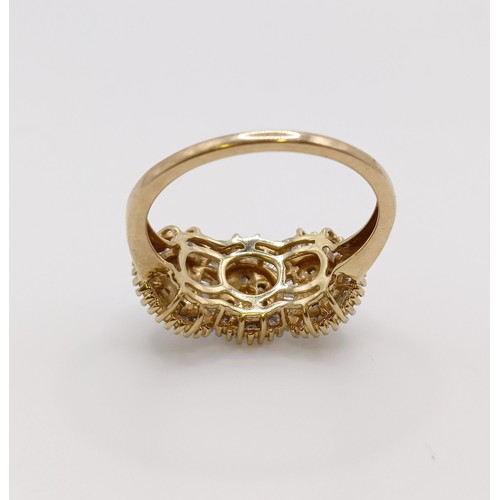 555 - A 9ct gold triple cluster ring, ring size S