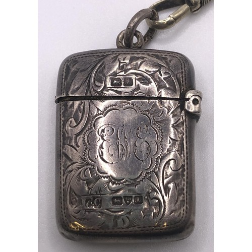 559 - A late Victorian silver vesta, on a silver plated Albert (2)