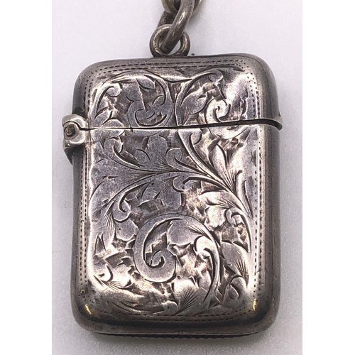 559 - A late Victorian silver vesta, on a silver plated Albert (2)