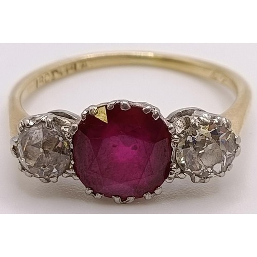 560 - An 18ct gold, ruby and diamond ring, ring size P