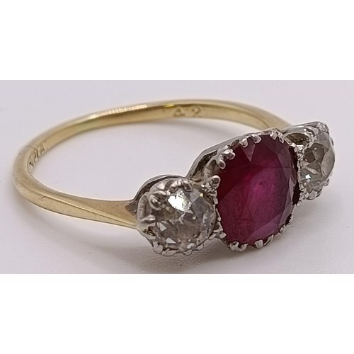 560 - An 18ct gold, ruby and diamond ring, ring size P