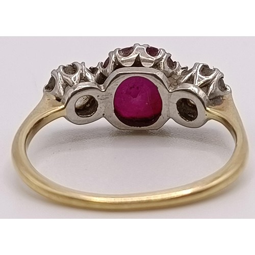 560 - An 18ct gold, ruby and diamond ring, ring size P