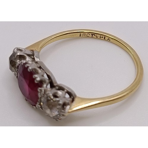 560 - An 18ct gold, ruby and diamond ring, ring size P