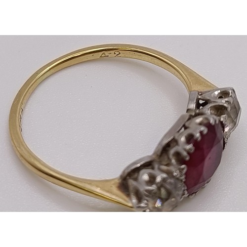 560 - An 18ct gold, ruby and diamond ring, ring size P