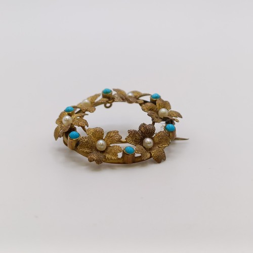 567 - An early 20th century turquoise and seed pearl floral brooch, 25 mm diameter