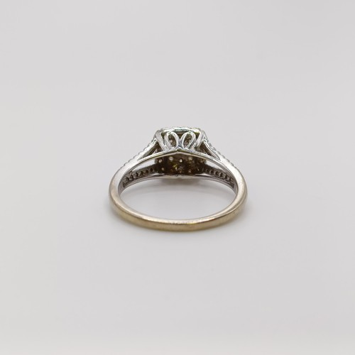 569 - A 9ct gold and diamond cluster ring, ring size N