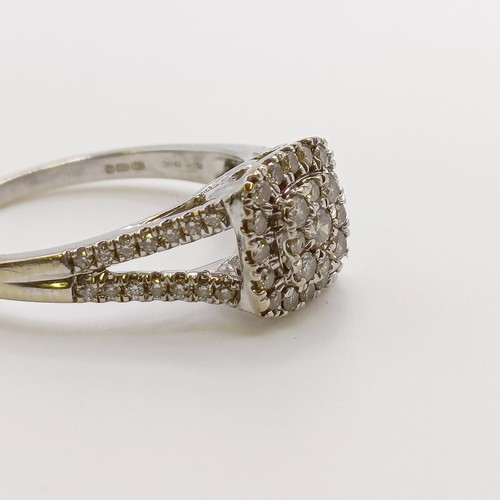 569 - A 9ct gold and diamond cluster ring, ring size N