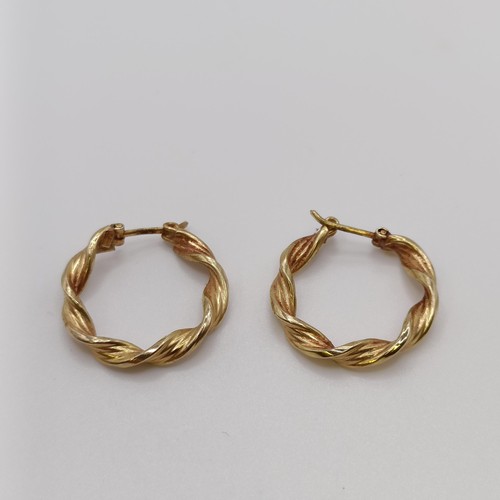 570 - A pair of 9ct gold hoop earrings, and another pair, 4.2 g