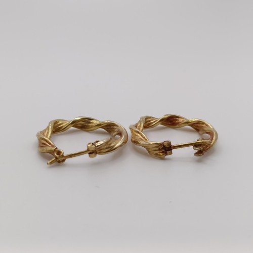 570 - A pair of 9ct gold hoop earrings, and another pair, 4.2 g