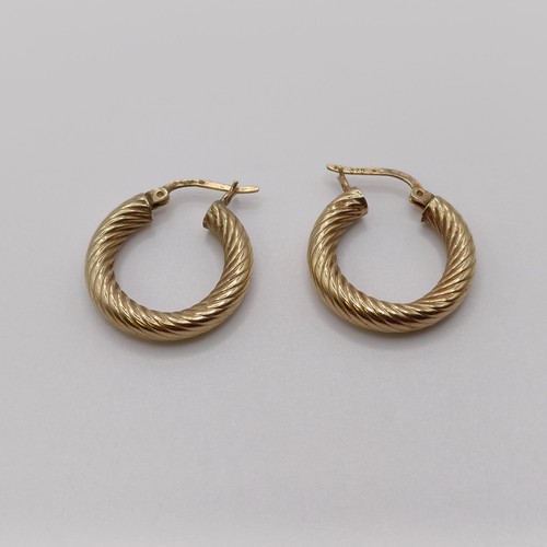 570 - A pair of 9ct gold hoop earrings, and another pair, 4.2 g