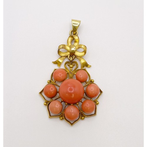 571 - A yellow metal and coral pendant