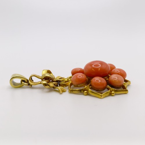 571 - A yellow metal and coral pendant