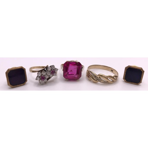 578 - A yellow metal and pink stone ring, ring size L, a crossover ring, a pair of studs, and a 9ct gold r... 