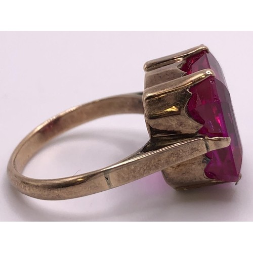 578 - A yellow metal and pink stone ring, ring size L, a crossover ring, a pair of studs, and a 9ct gold r... 