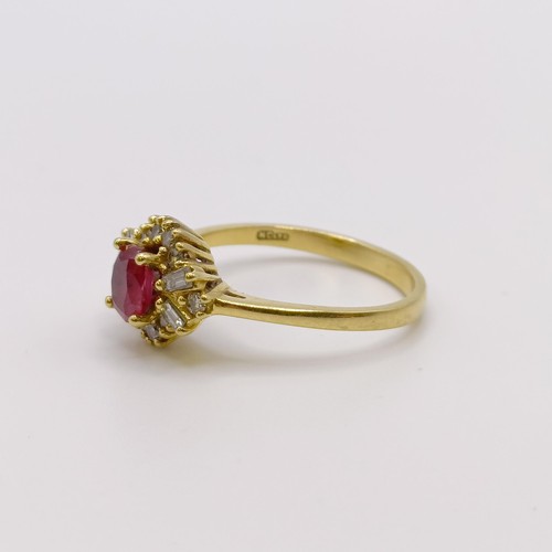 579 - An 18ct gold, diamond and ruby ring, ring size N