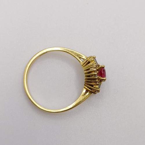 579 - An 18ct gold, diamond and ruby ring, ring size N