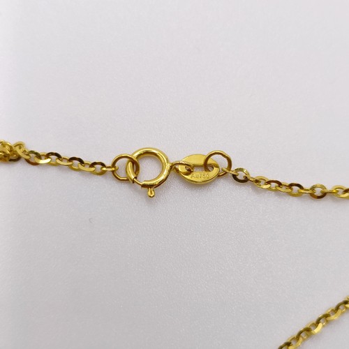 580 - An 18ct gold, coral and diamond pendant, on an 18ct gold chain