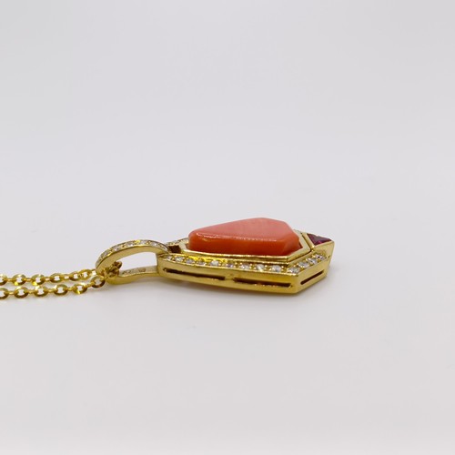 580 - An 18ct gold, coral and diamond pendant, on an 18ct gold chain