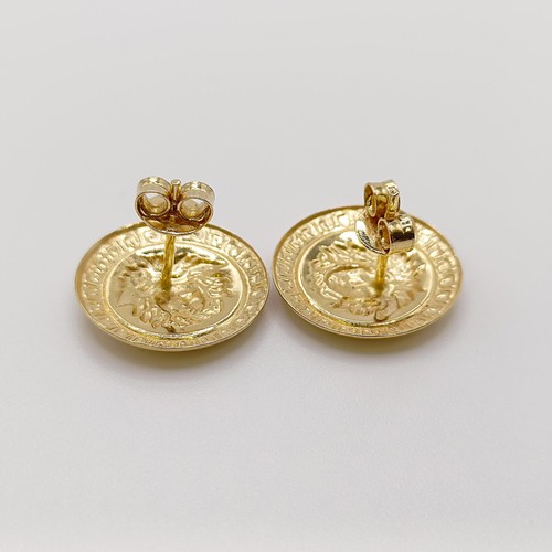 584 - A pair of 18ct gold Versace style stud earrings