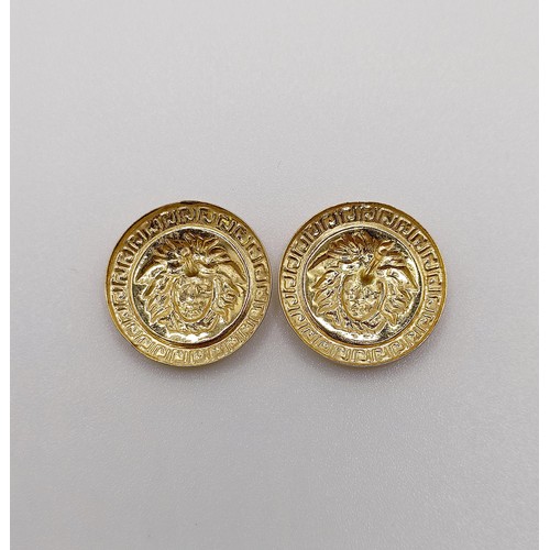 584 - A pair of 18ct gold Versace style stud earrings