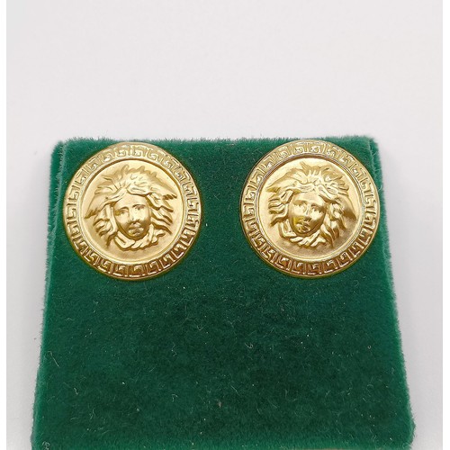 584 - A pair of 18ct gold Versace style stud earrings